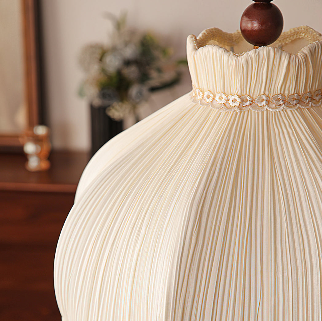 Close view of the fine vertical pleats and the floral lace band at the neck of this Clérachic pendant shade.