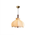 Beige pleated Clérachic pendant with a brass canopy, walnut beads and a thin cord, on a white background.
