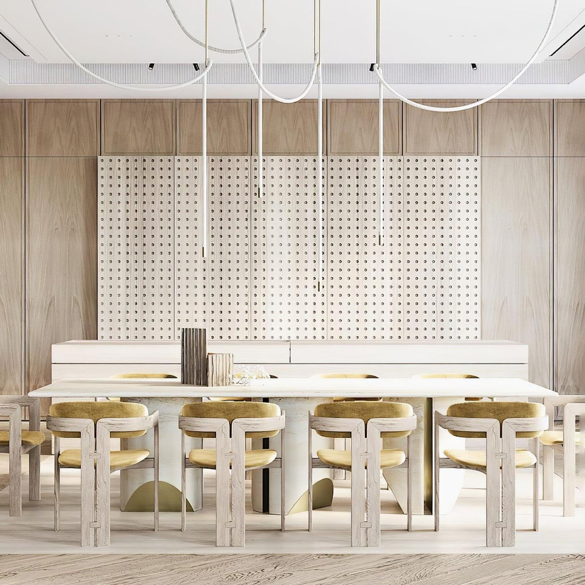 Pale Clérachic rope pendants hanging over a long white table with gold-cushioned chairs, in front of a perforated wooden wall.