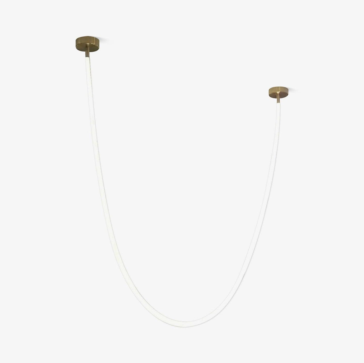 This Clérachic LED rope pendant on a pale backdrop, unlit, a thin white tube looped between two gold-toned ceiling plates.