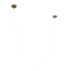 A very pale view of this Clérachic LED rope pendant on white, with the thin tube barely visible between two gold-toned plates.