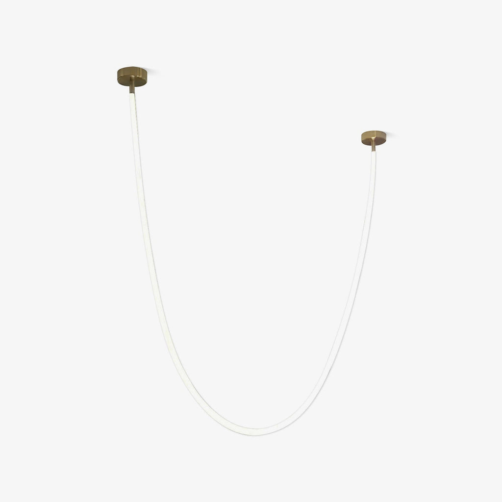 A shorter Clérachic LED rope pendant on a pale backdrop, unlit, with two gold-toned plates at different heights.