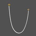 A Clérachic LED rope pendant on a dark grey backdrop, lit bright white along a deep U between two gold-toned plates.