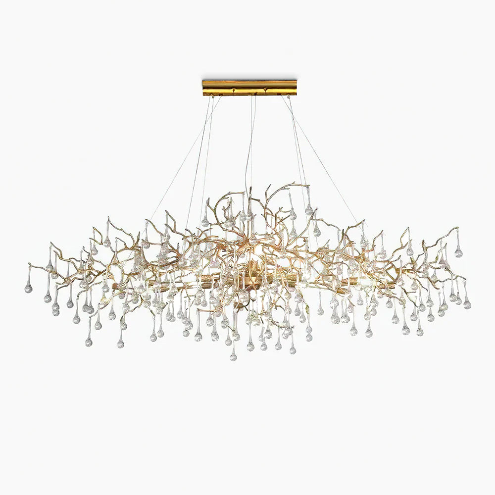 The Clérachic Bijou chandelier fuller on white, glass teardrops massed beneath the gold branches.