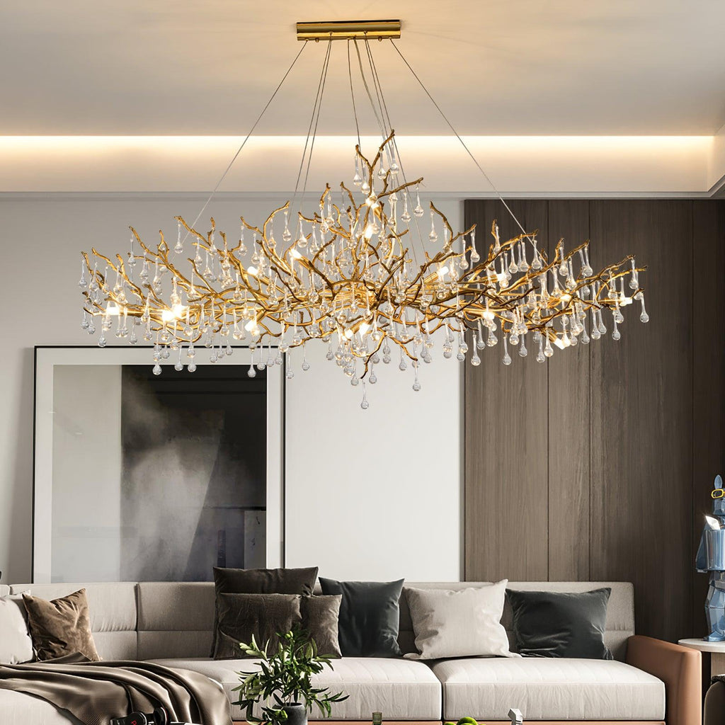 The Clérachic Bijou chandelier lit over a sofa against dark timber panelling and a tall mirror.