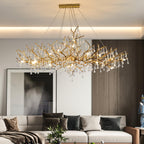 The Clérachic Bijou chandelier lit over a sofa against dark timber panelling and a tall mirror.