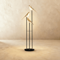 Clérachic three-head bird floor lamp, 153 cm tall, with gold-finish bird shades glowing warm white on slim black stems