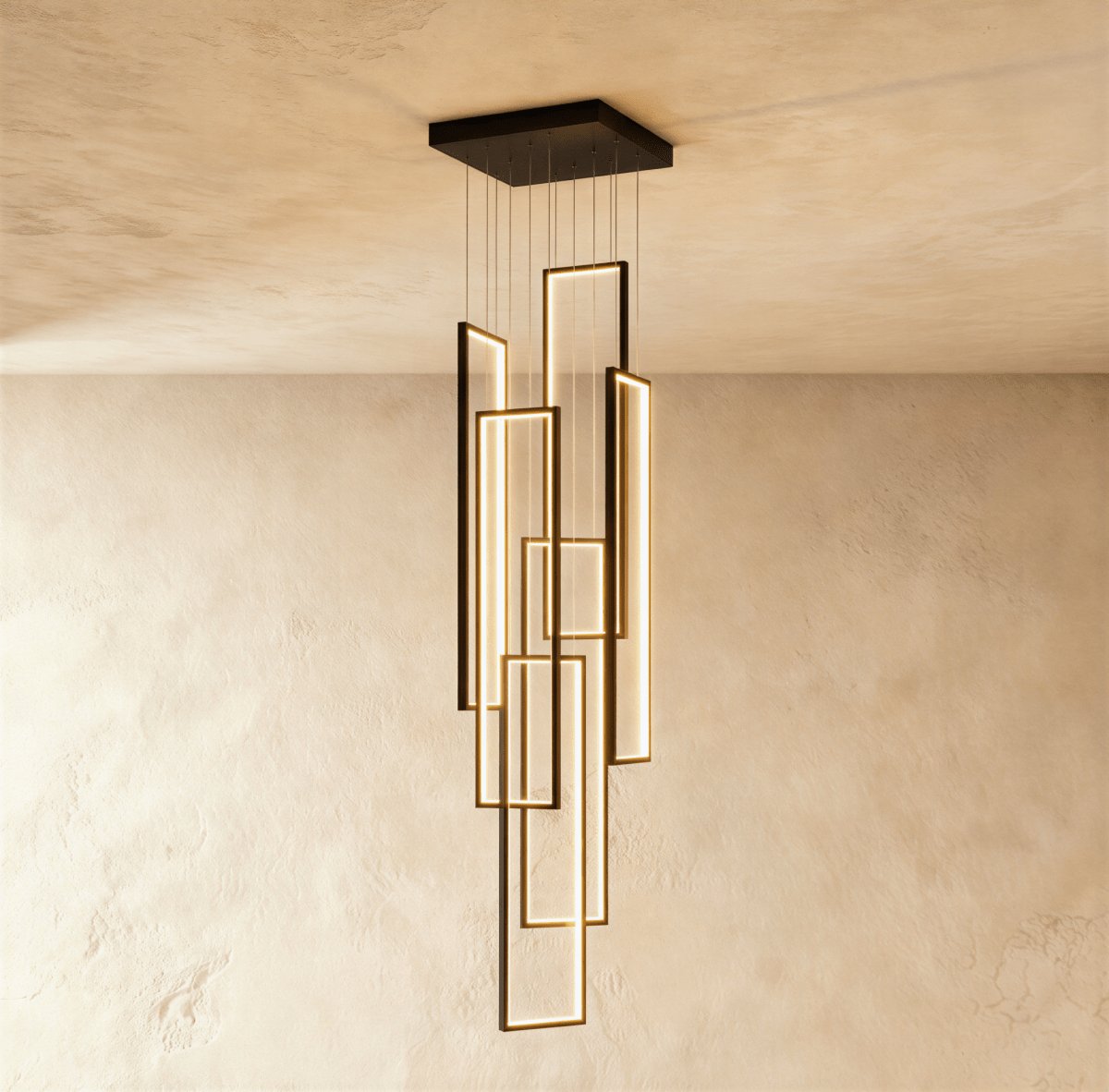 Clérachic black stairwell chandelier with six slim LED frames at staggered heights, hung from a square canopy on a plaster wall.
