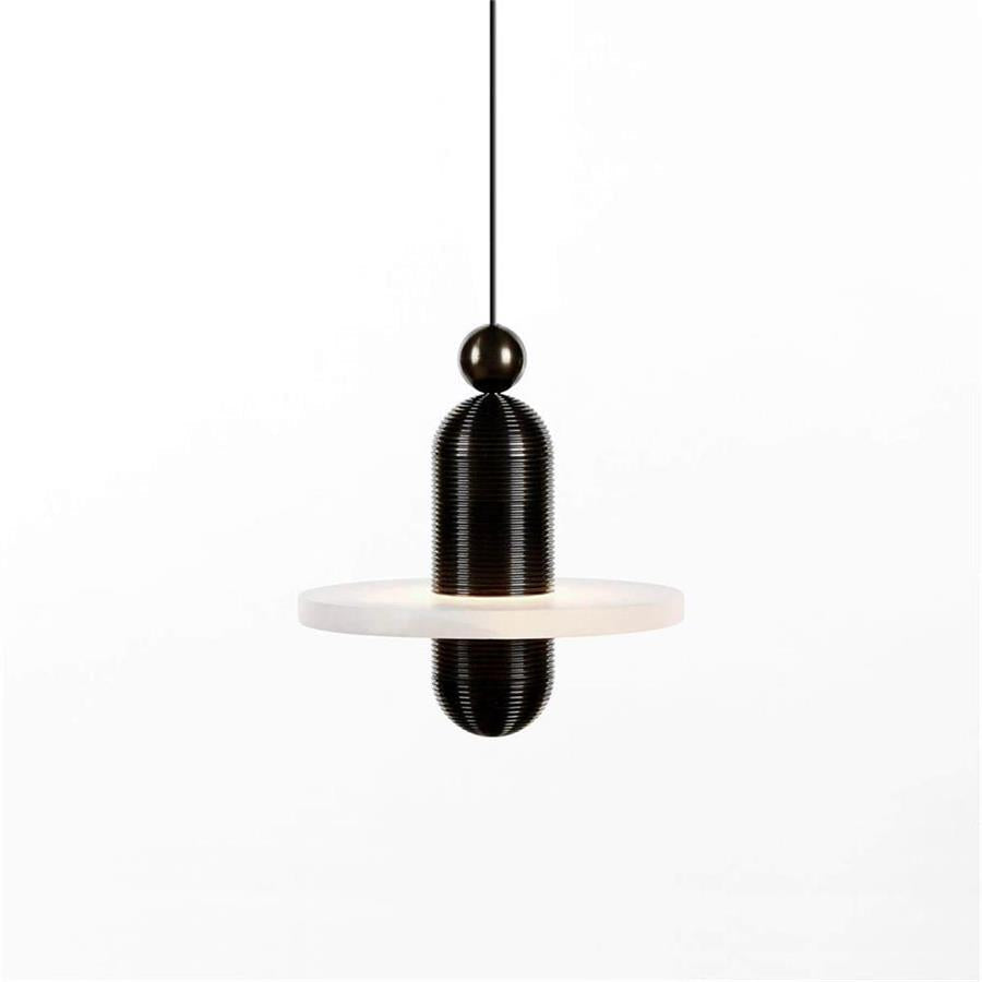 Clérachic black-hardware pendant, single alabaster disc and a small black sphere at the cord, lit in studio.