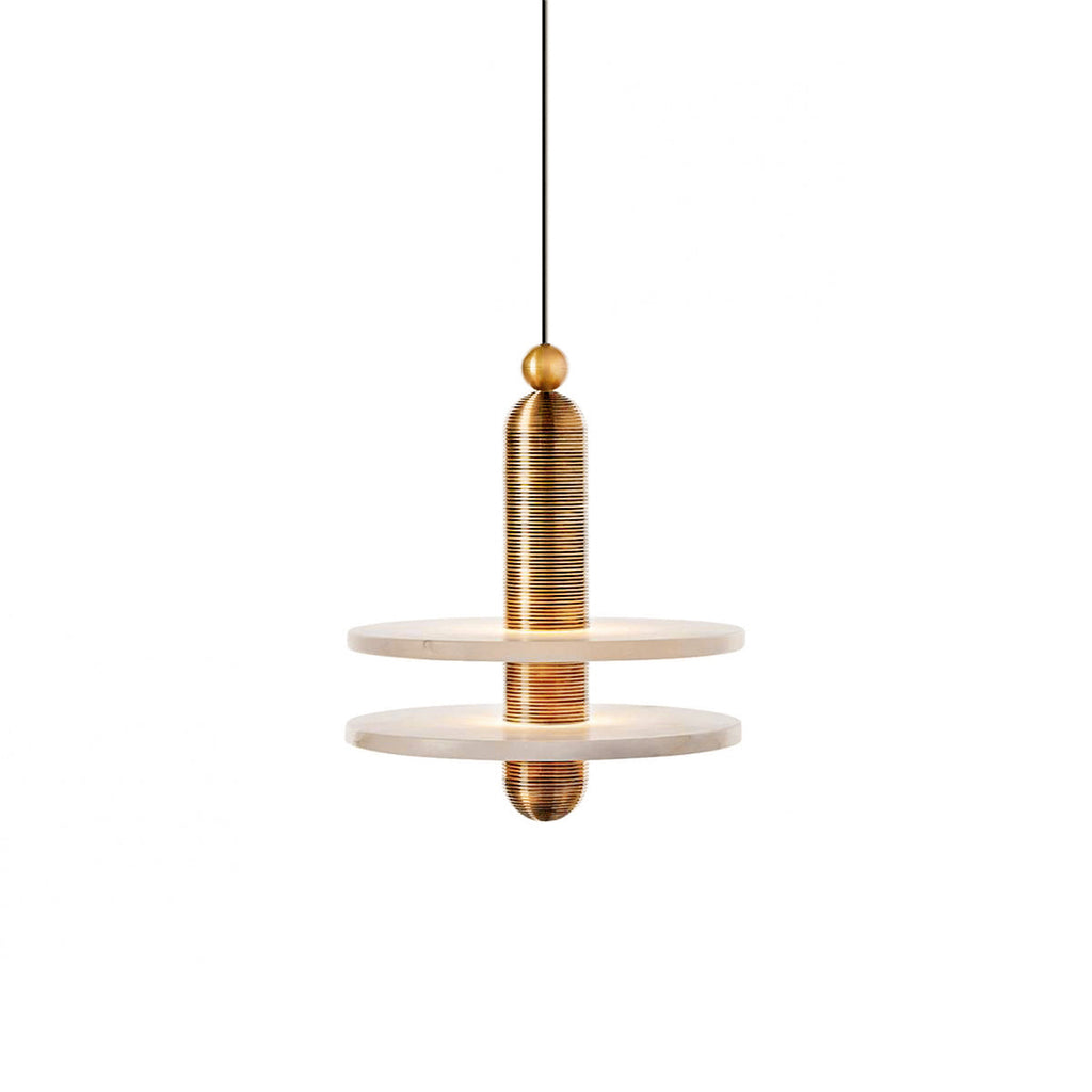 Clérachic gold double-disc pendant, stacked alabaster plates glowing on brushed gold hardware against white.