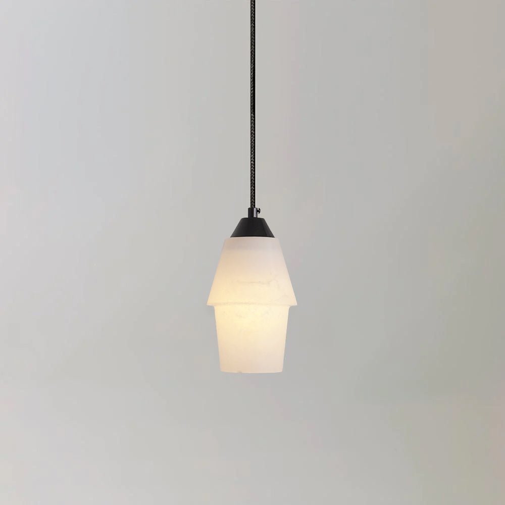 The Clérachic Black and White Alabaster Pendant Light stepped in two white tiers, black hardware on a plain wall.