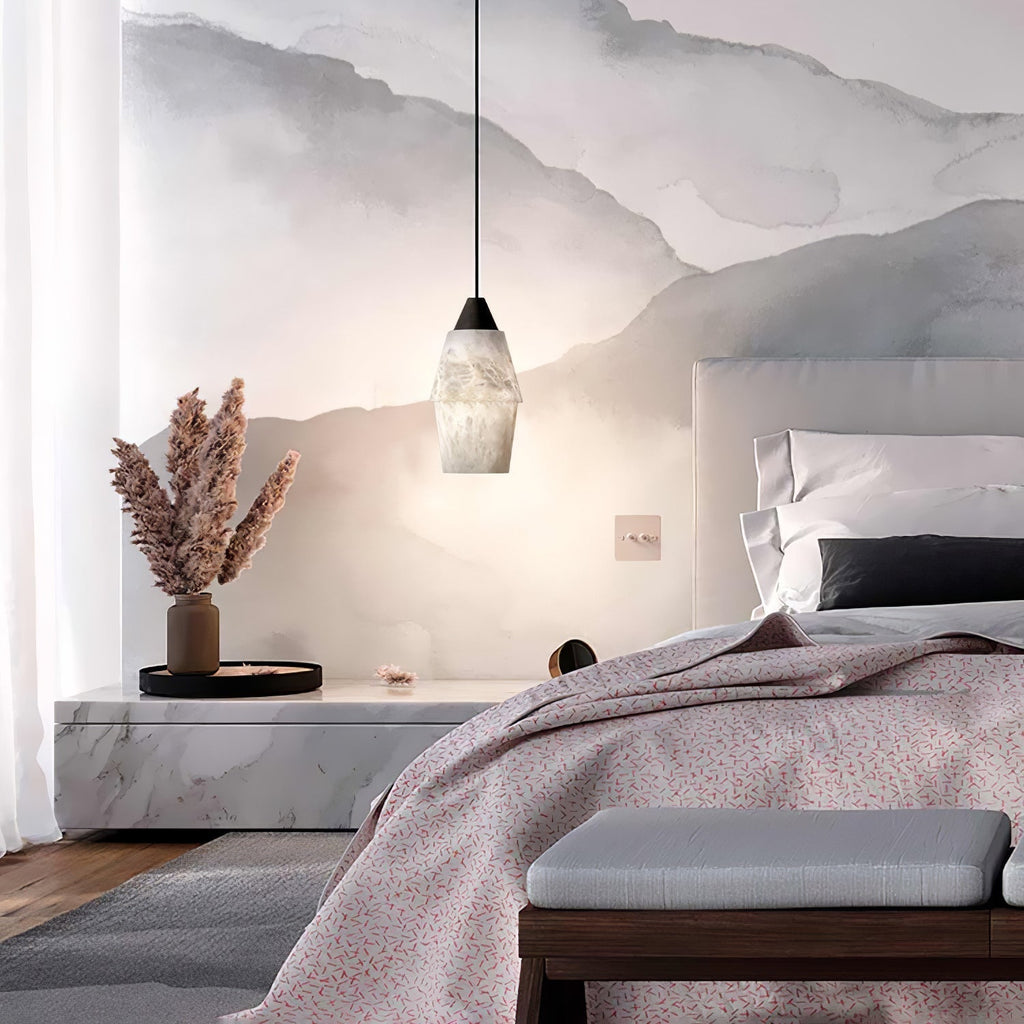 Clérachic Black and White Alabaster Pendant Light hangs in a mountain-mural bedroom with a marble plinth, pampas grass, and a pink duvet.