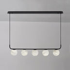 Five alabaster globes in a straight line on the Clérachic black bar pendant, photographed unlit against a soft grey wall.
