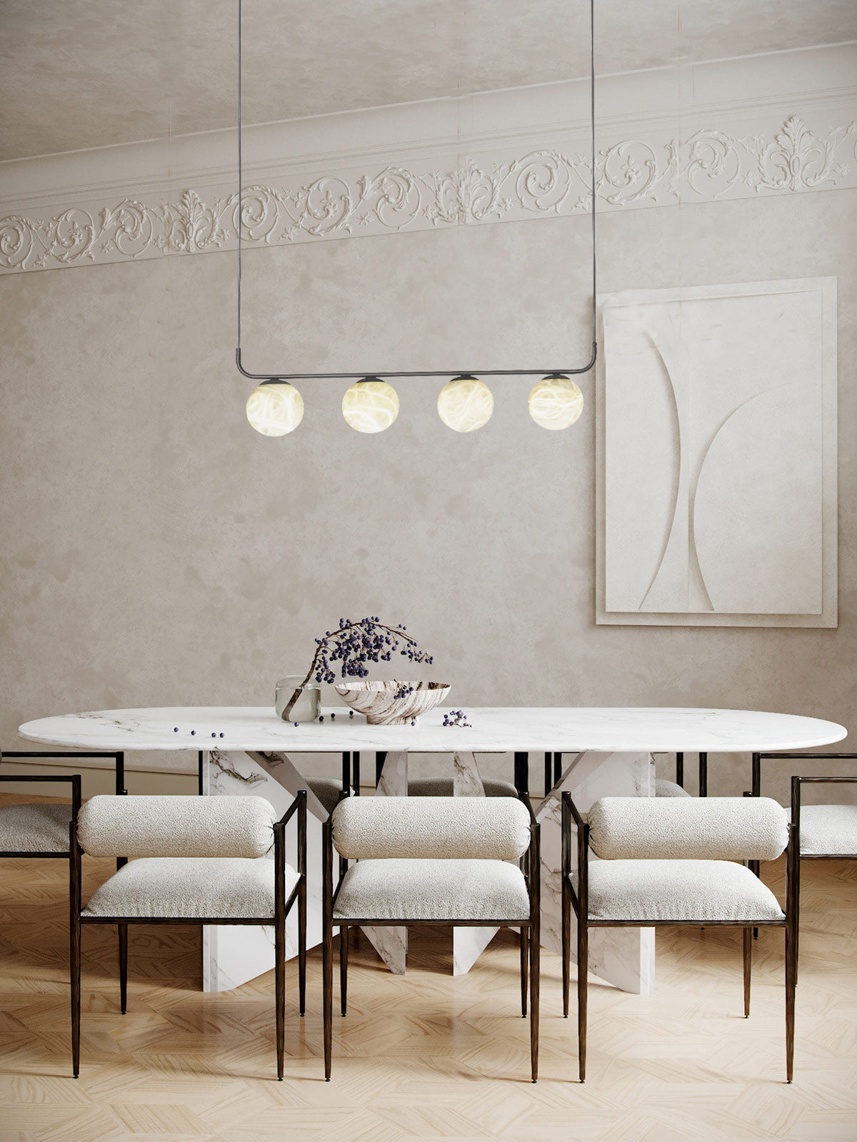 Clérachic four-globe pendant in a classic room with plaster cornice, floating above a white marble oval table.