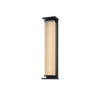 A taller Clérachic wall light with a ribbed cream shade and a black frame, unlit on a plain white backdrop.