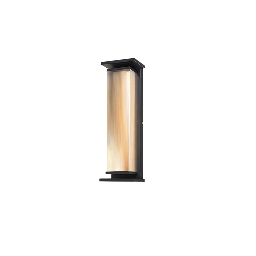 A small Clérachic wall light with a ribbed cream shade in a black frame, on a plain white backdrop.