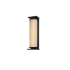 A small Clérachic wall light with a ribbed cream shade in a black frame, on a plain white backdrop.