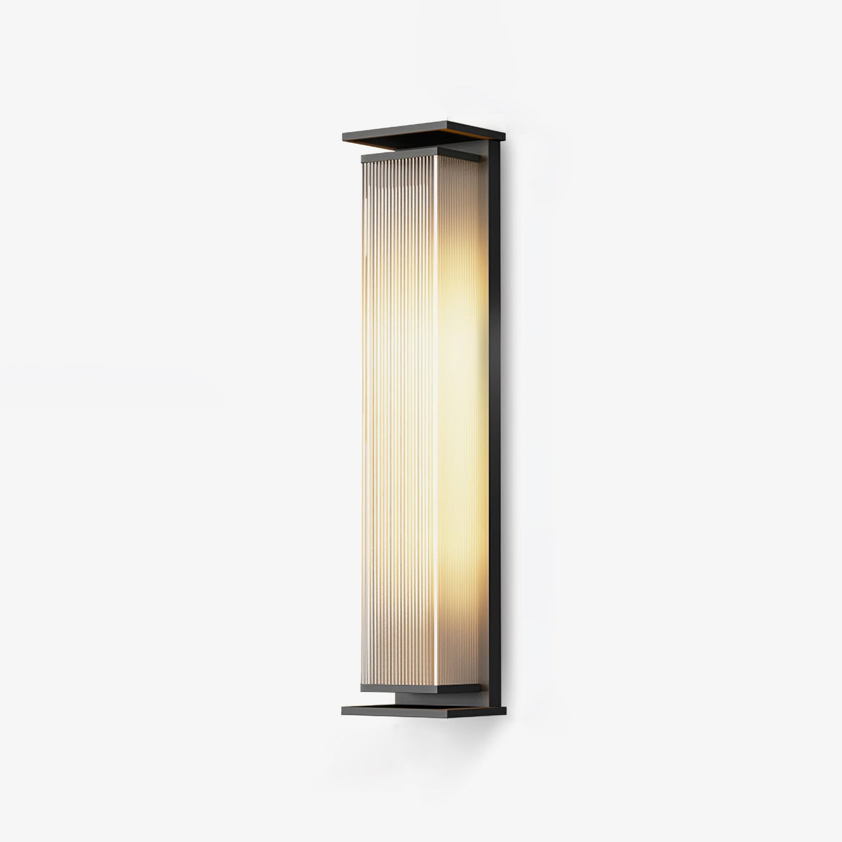 This Clérachic wall light in a tall size on a pale backdrop, lit warm behind its ribbed glass shade.