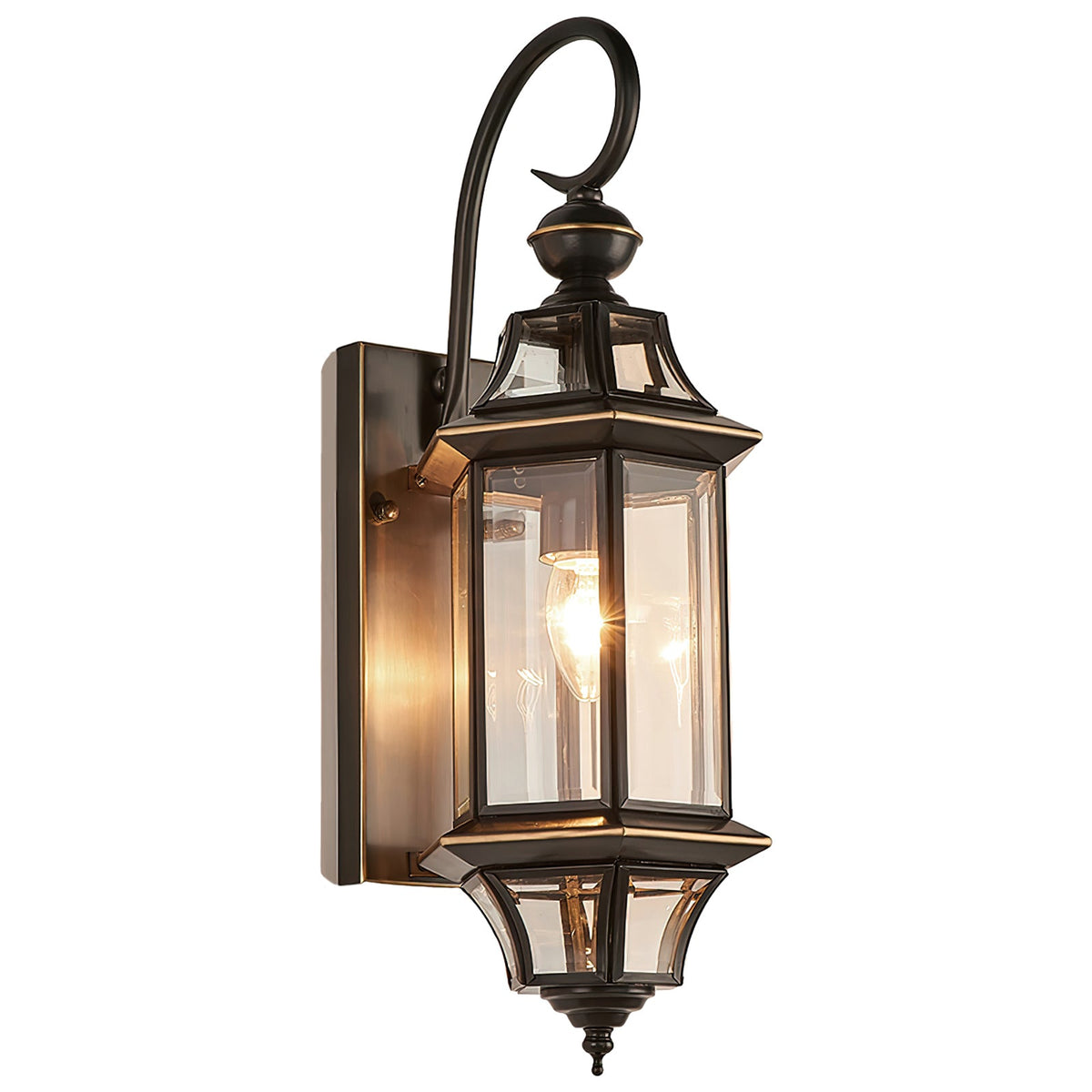 Studio view of the Clérachic wall lantern lit on white, showing the backplate, hooked arm and pointed bottom finial.