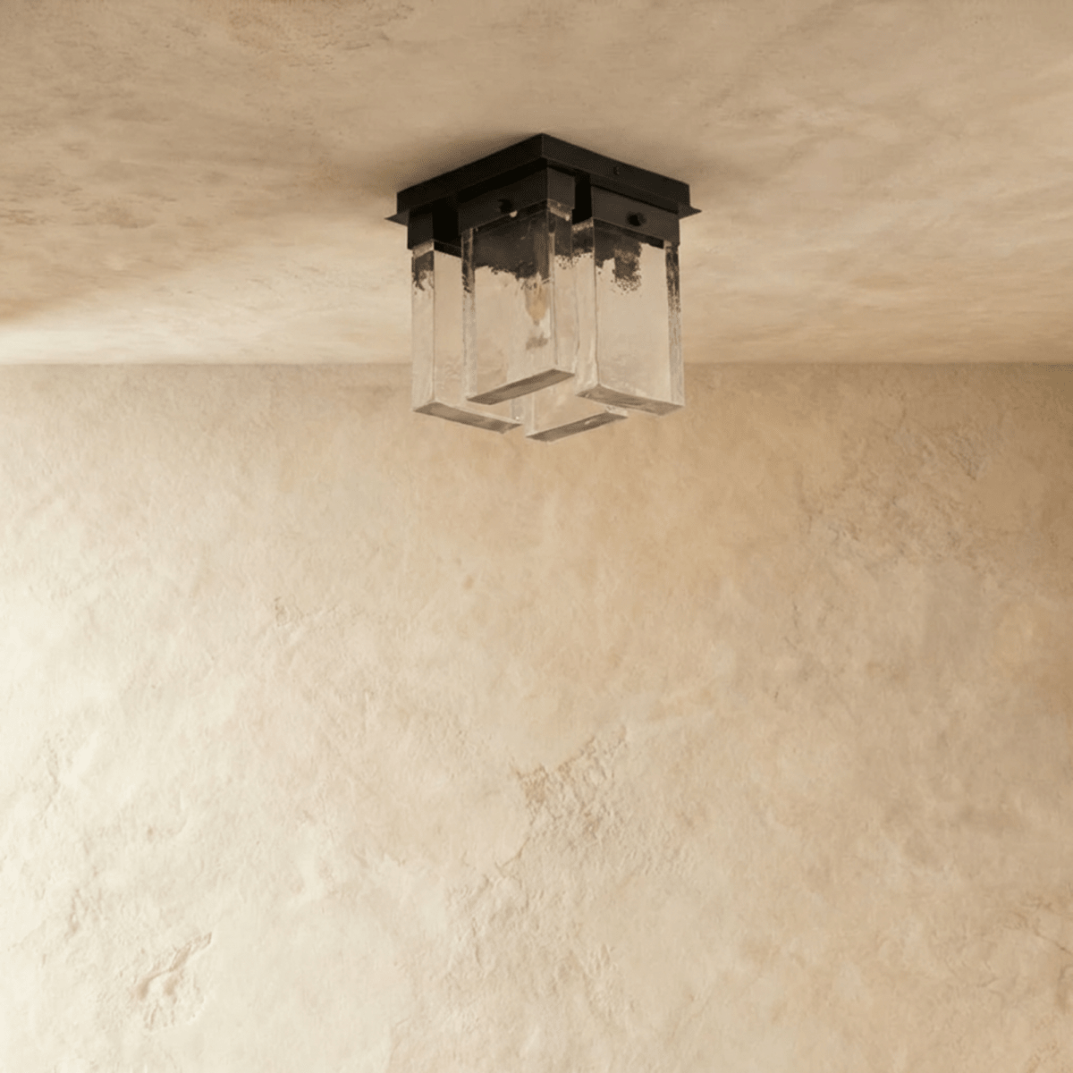 Clérachic ceiling light switched off: four rectangular textured glass panels beneath a square black metal mount on pale plaster.