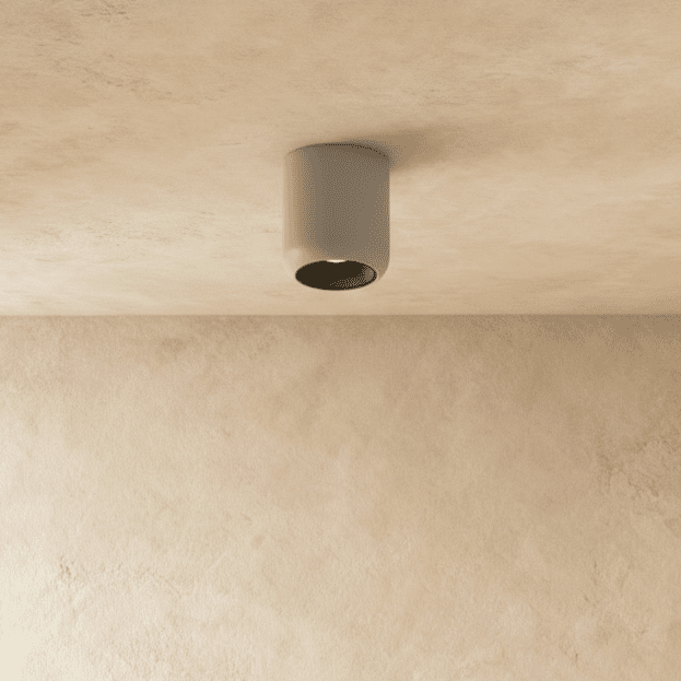 Clérachic downlight with a black interior ring inside its white cylinder housing, mounted flush to the ceiling.