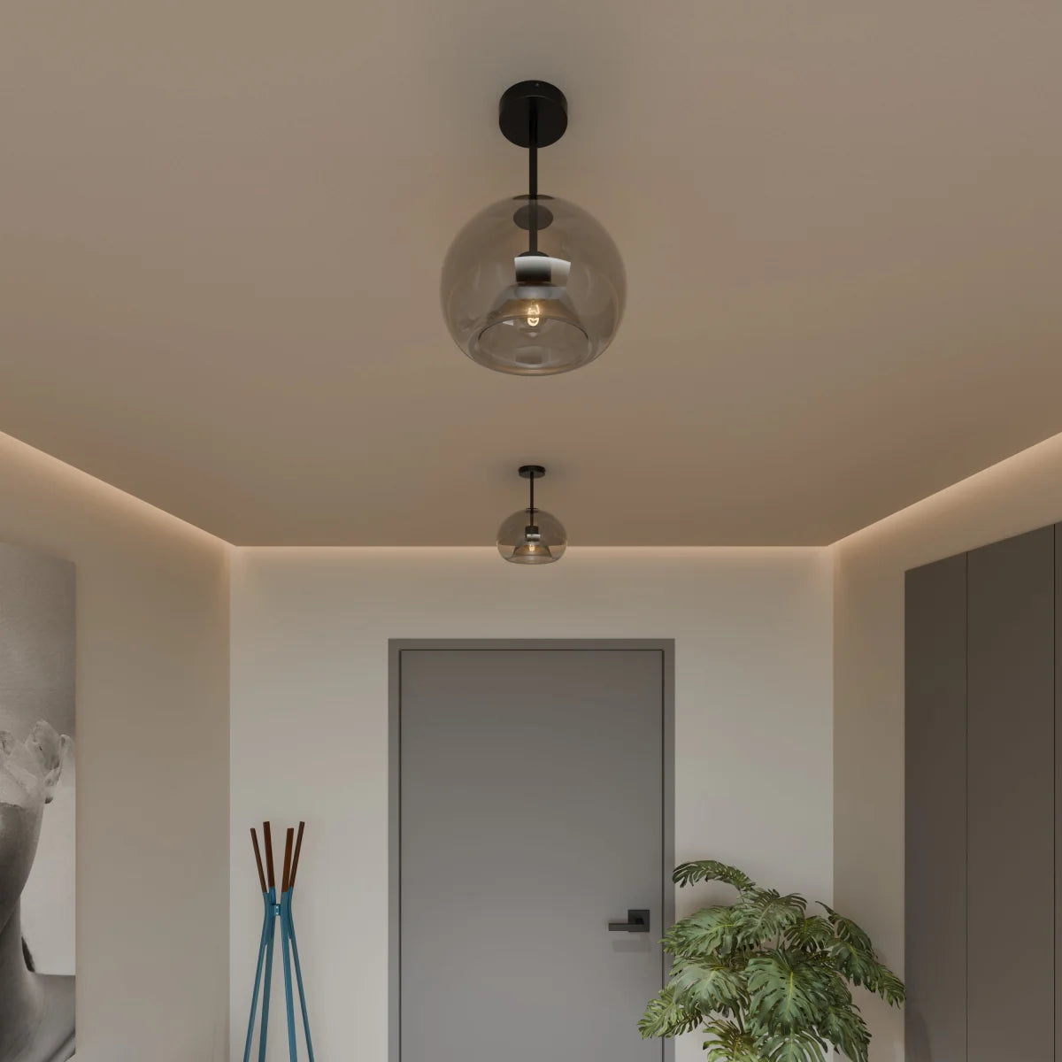 Clérachic smoked glass globe pendant and flush-mount ceiling lights, black hardware, in a modern hallway.