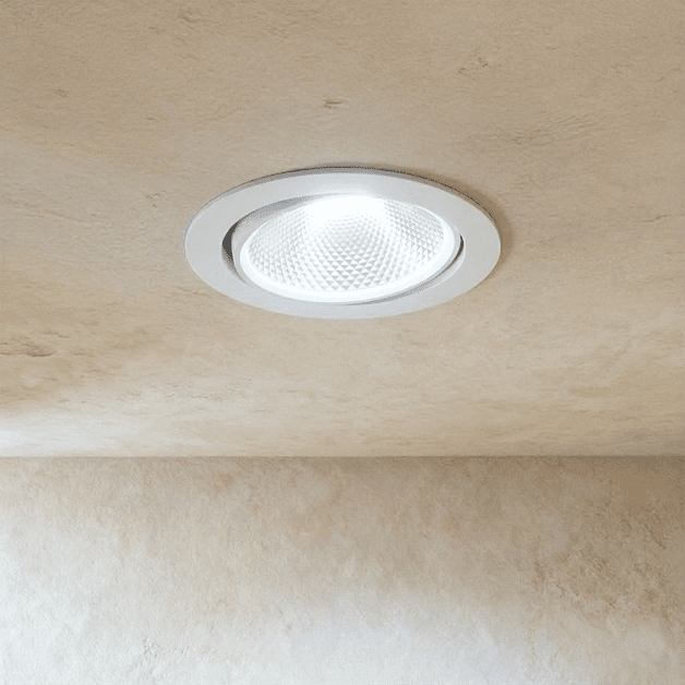 Clérachic downlight in white, the round adjustable trim casting a bright cool-white beam from the ceiling.