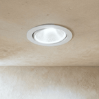 Clérachic downlight in white, the round adjustable trim casting a bright cool-white beam from the ceiling.