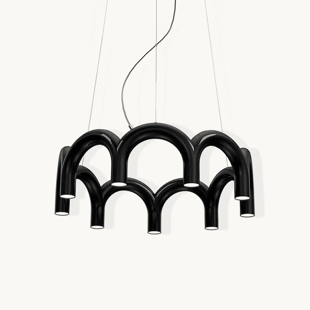 A black Clérachic chandelier made of two tiers of tubular arches, with downward-facing lights, on a plain white backdrop.