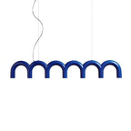 A blue arched Clérachic chandelier on two cables and a curved cord, on a plain white backdrop.