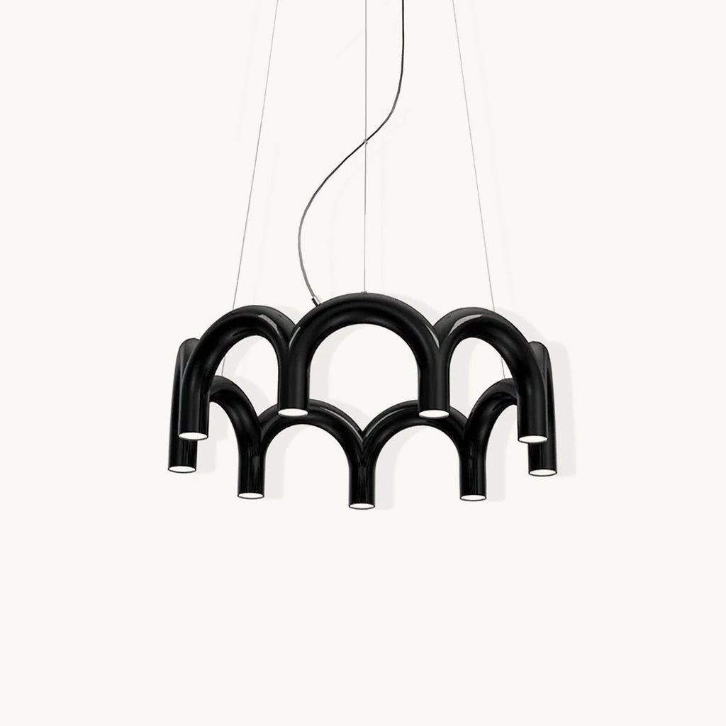 A black tiered-arch Clérachic chandelier on a soft off-white backdrop, hung on three cables.