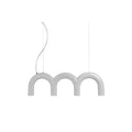 A short white Clérachic chandelier made of three arches, hung on a curved cord and a thin cable, on white.