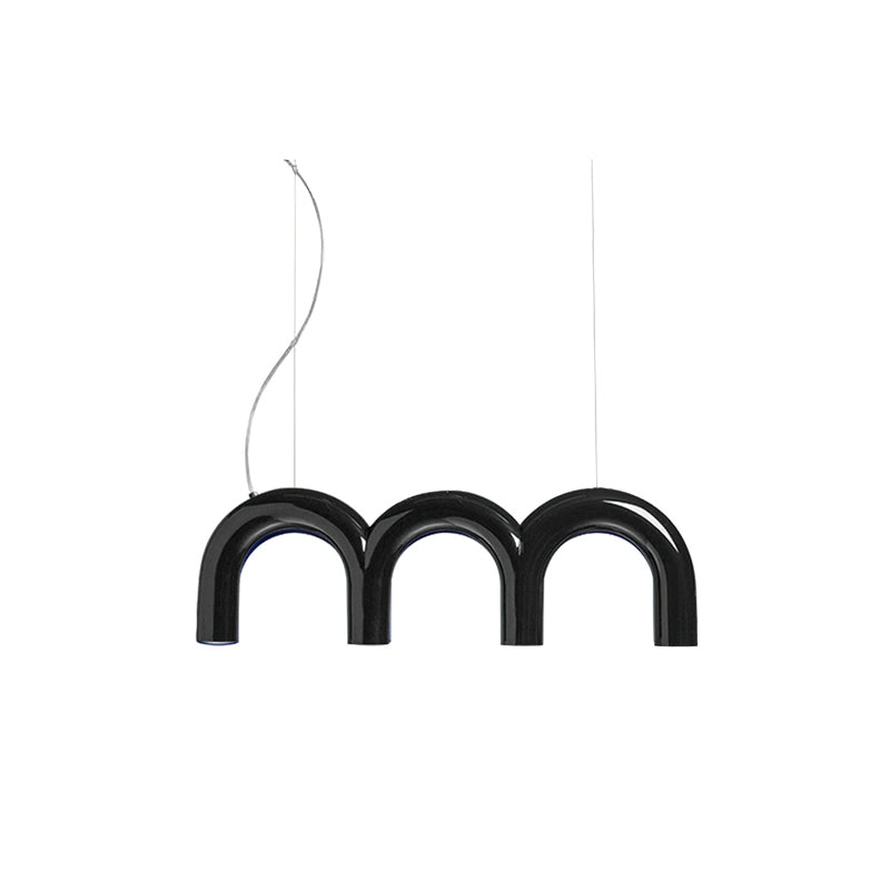 A short black Clérachic chandelier made of three glossy arches, hung on a curved cord and a thin cable, on white.