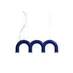 A short blue Clérachic chandelier made of three arches, with lights in each leg, on a plain white backdrop.