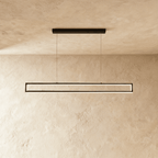 Clérachic black rectangular-frame pendant light, its slim LED edges glowing warm white beneath a plastered ceiling.