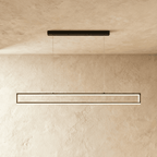 Straight-on view of the Clérachic black frame pendant, twin LED strips glowing warm white on thin support cables.