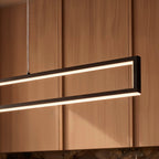 Close-up of the Clérachic black frame pendant's LED edge glowing warm white against a wood-panelled wall.