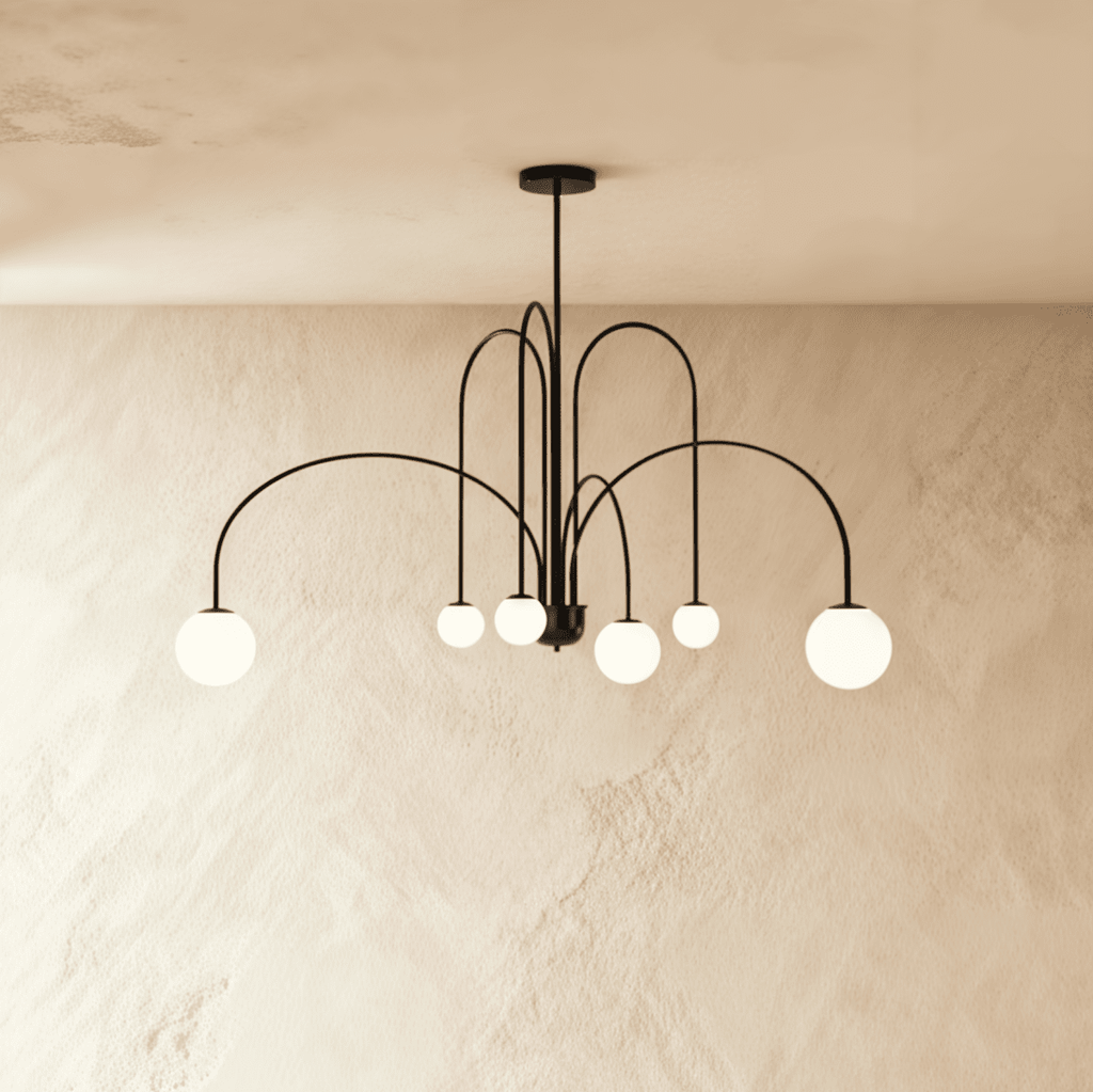 This Clérachic black Art Deco chandelier spreads its looped arms wide, each ending in a round glass globe.
