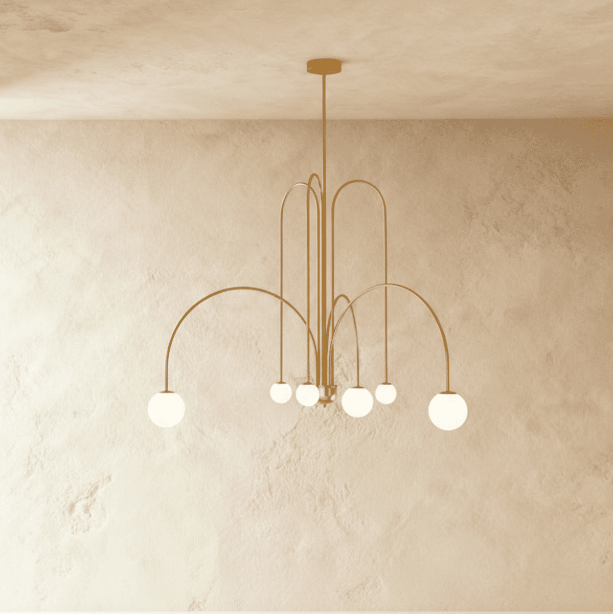 Clérachic's gold Art Deco chandelier arcs six curved arms outward, each tipped with a glowing white globe.
