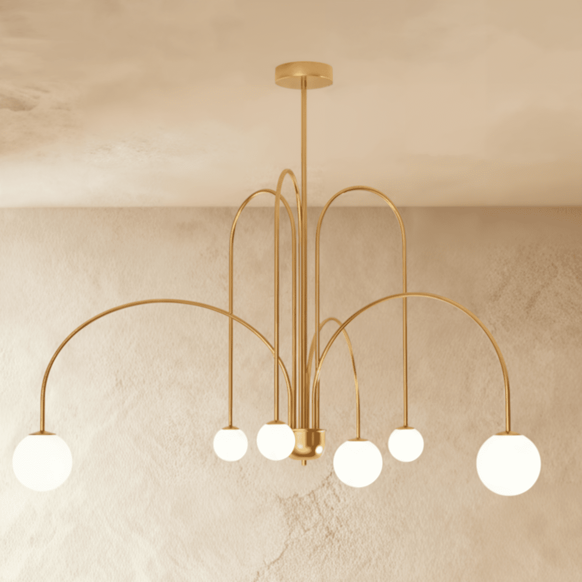 This Clérachic gold Art Deco chandelier hangs with looped brass-toned arms and six round glass globes.