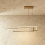 Clérachic's chandelier in gold, its interlocking linear bars forming a geometric maze suspended overhead.