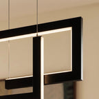 A close detail of the Clérachic chandelier in black, showing how its linear LED bars interlock at the joints.
