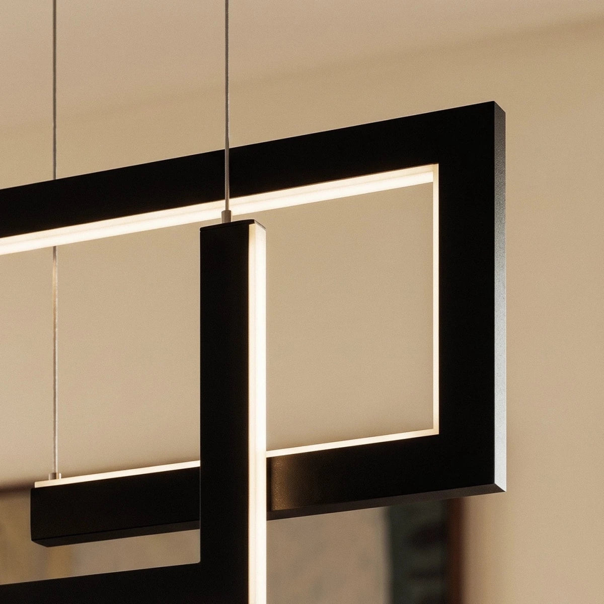 A close detail of the Clérachic chandelier in black, showing how its linear LED bars interlock at the joints.