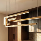 A close detail of the Clérachic chandelier in gold, showing how its linear LED bars interlock at the joints.