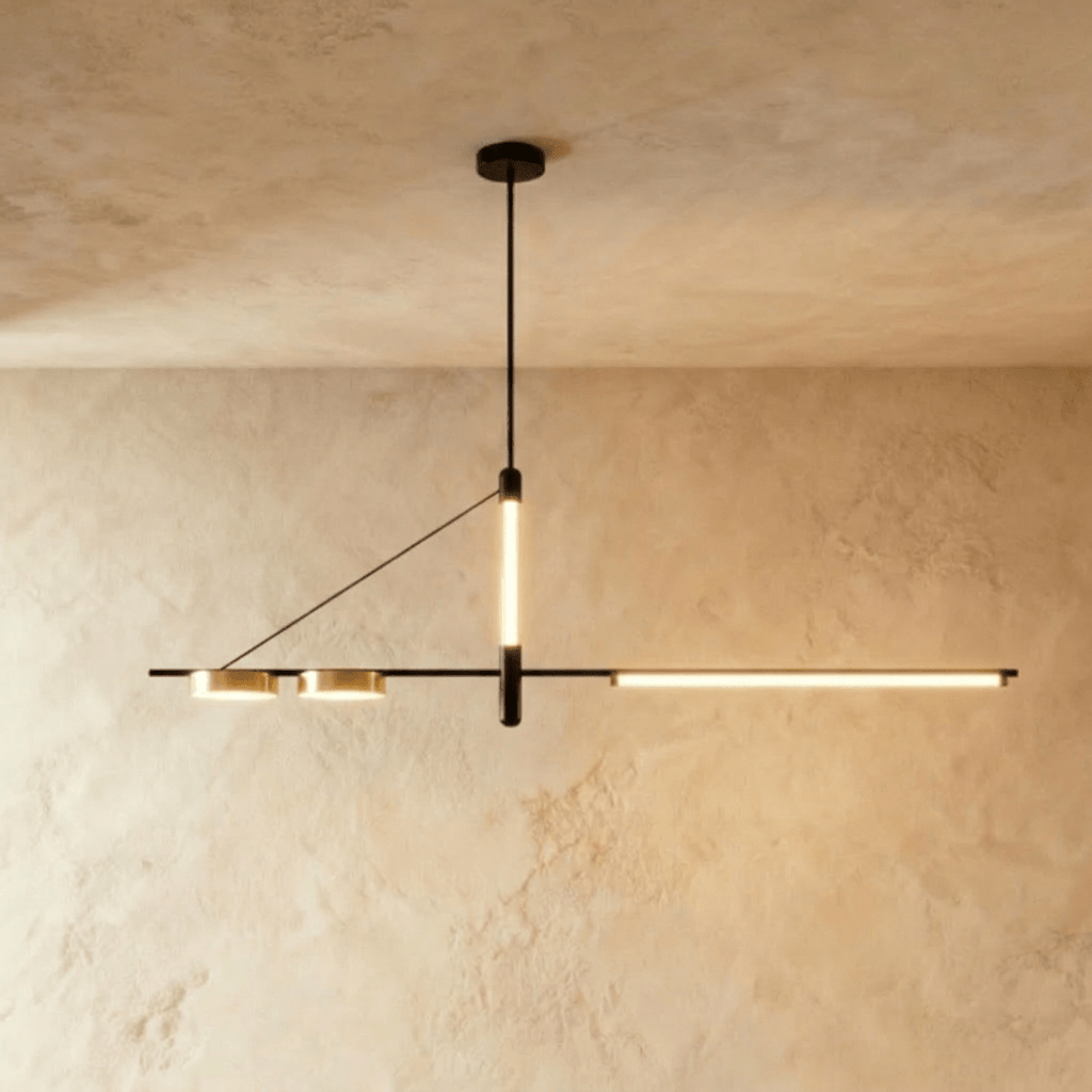 Clérachic black linear chandelier hung from a round ceiling plate, a vertical LED tube and a long LED bar lit warm against plaster.