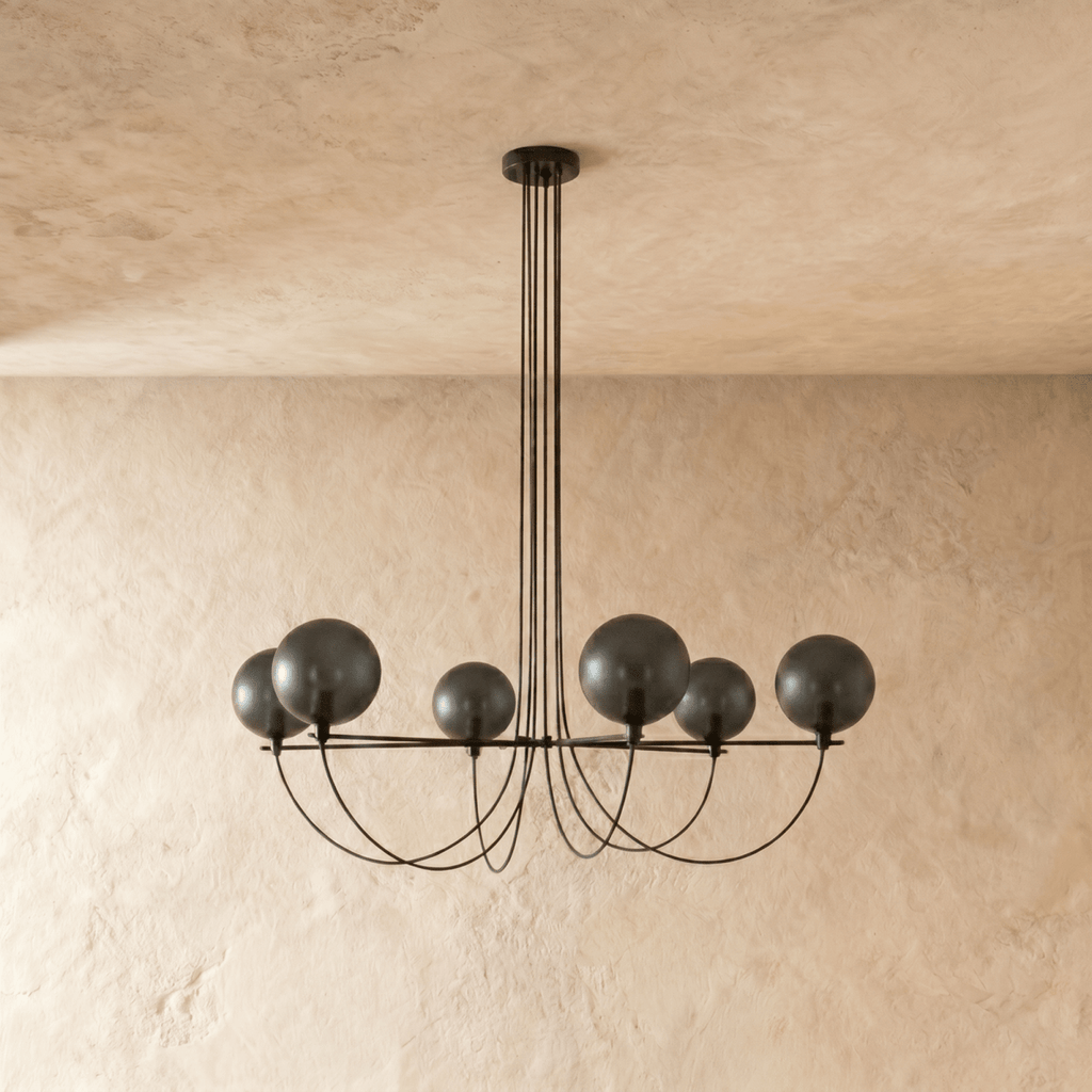 Clérachic six-globe chandelier unlit, showing dark smoky glass shades on a black iron armature with draped cords.