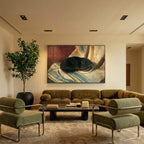 Several Clérachic black recessed downlights glowing warm white above an olive velvet sofa and a framed painting.