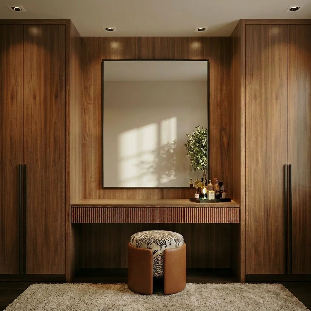 Clérachic white recessed downlights glowing warm white above a wood dressing nook with a mirror and stool.