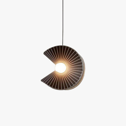 Clérachic pendant light lit, the glow through the shade in a quiet room.