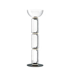 Clérachic floor lamp on white, three clear glass cylinders under a wide glass bowl, on a flat round black base.